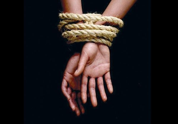 picture of hands tied with rope