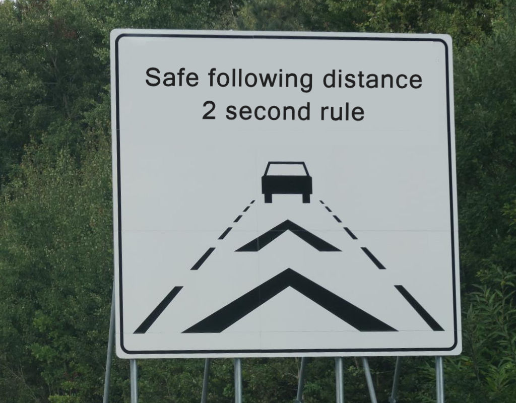 picture of a sign Safe following distance - 2 second rule