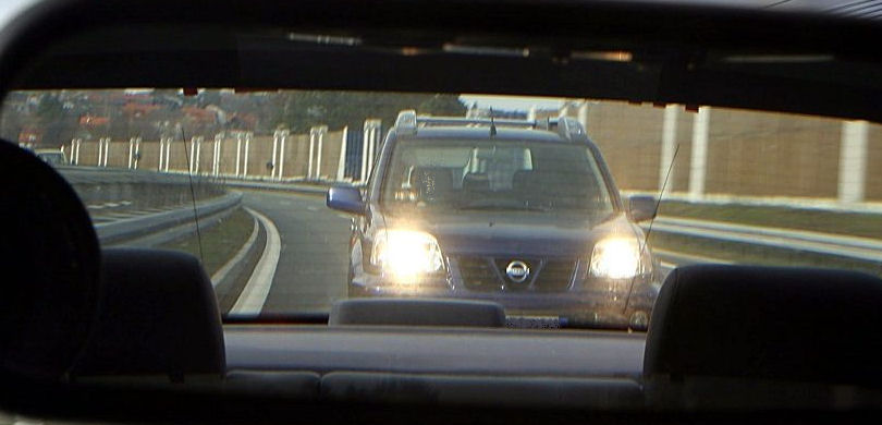 picture of tailgating seen through the rear window of the car