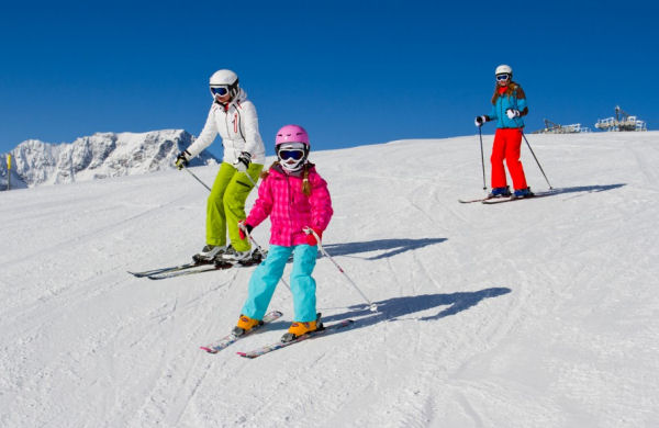 picture of three children skiing