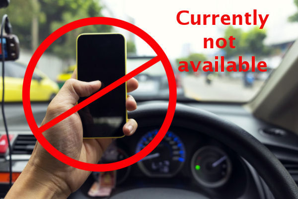 picture of a crossed-out mobile phone in the driver's hand